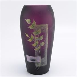 Fenton Purple Glass Vase: A Fenton purple glass vase. This frosted purple glass vase features floral and geometric accents. It is marked to the underside “Fenton, hand painted in USA, George W Fenton, 2007 hand painted by S. Stephens.”