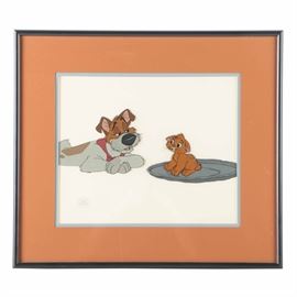 The Walt Disney Company Sericel From "Oliver & Company": A sericel from Oliver & Company, manufactured by The Walt Disney Company. This cel on acetate depicts Dodger laying down and slyly talking to Oliver, who hesitantly sits on an upturned, silver platter. To the lower left corner of the composition is a circular emblem for the animation studio. The cel is presented under glass beneath layered matting in a black metal frame with hanging wire to the verso. Also found to the verso is a handwritten note contextualizing the exact scene in which this still was taken from.