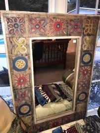 There are a couple of these cute carved mirrors 