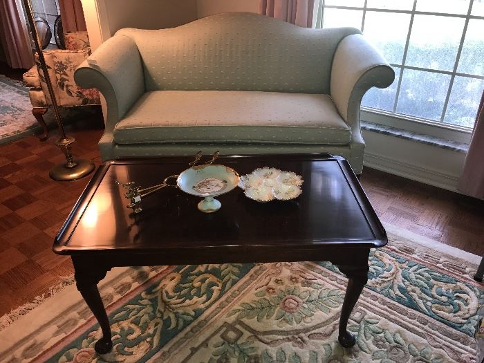 High Quality Cherry Coffee Table with Extension Leaves inside on both ends and an adorable mint condition love seat. 