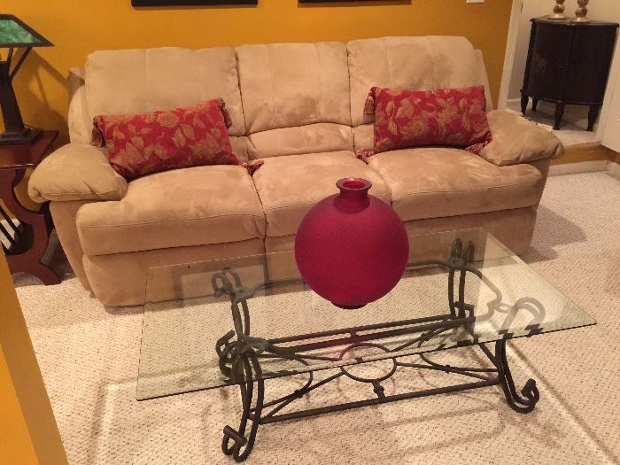 Reclining sofa and glass coffee table