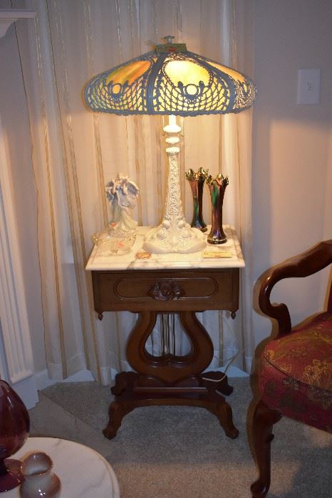 Large Gorgeous Leaded Glass Lamp. This lamp is Special! An Awesome Design with Original Leaded Glass. This Lamp is so Heavy that I can hardly pick it up with two hands unless I remove the Shade! And it sitting on a Beautiful Antique Marble Top Lyre Table with Carnival Glass Vases and More!
