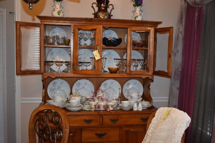 Beautiful Quality China Hutch with  a Gorgeous Display of China. The Hutch features Glass Doors, Pull Drawers, Plate Lines plus Cabinet Door Storage 