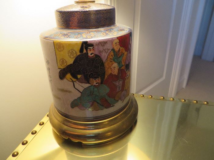 Oriental lamp with oriental Gods painted on sides. Bottom is brass. Really nice