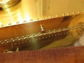 Front of brass box on stand. Inside is lined.