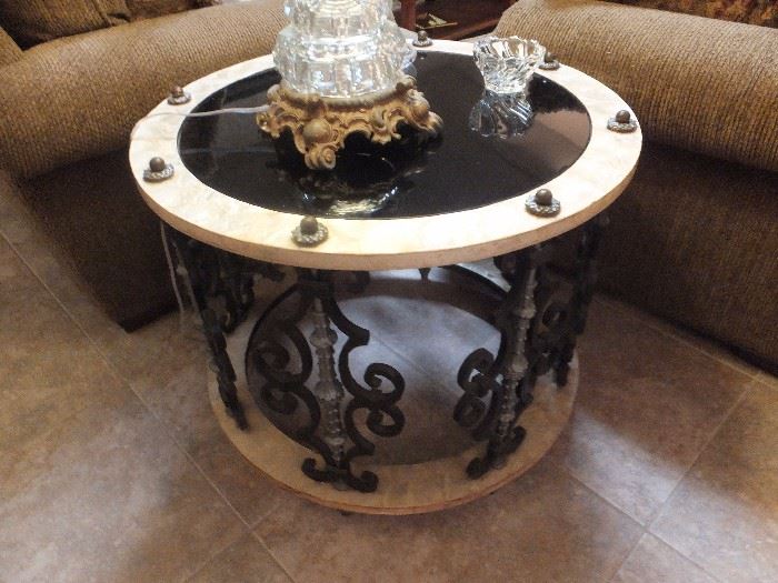 round table with metal base and mother of pearl accent