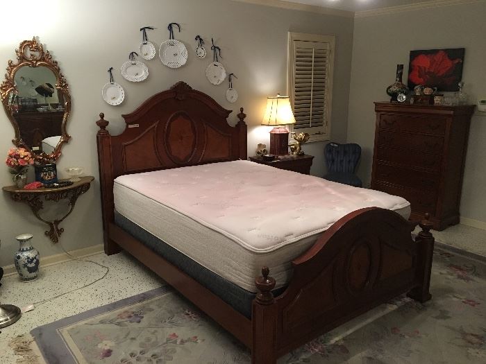 Queen bedroom suite w/ dresser, chest, armoire and nightstand.
