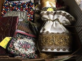 We have boxes of fancy handbags and purses!
