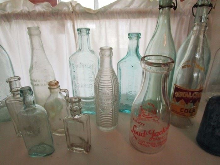 Signed antique alcohol, soda and medicine bottles