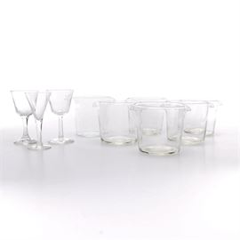Ice Buckets and Stemware: An nine piece assortment of ice buckets and stemware. The six glass buckets feature dual end spouts to pour off ice melt. The three pieces of stemware include two wine glasses and one cocktail glass.