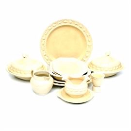 Adams "Della Robia" Titan Ware English Serving Pieces C.1922-30: A collection of Adams serving wares in the Della Robia pattern. The Adams Titan Ware was first patented in 1922. This set consists of molded decoration on the borders in the style of the Italian maiolica by the Italian sculptor from Florence Della Robia. The group is composed of two lidded oval vegetable dishes, a small jug, a sauce boat with under tray, an oval platter. two square plates, an egg cup and an open oval vegetable. The collection has printed marks reading “Adams Titan Ware” and Royal Ivory England Patented 70566". Please see 055, 054, and 053 for matching pieces.