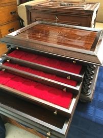 We think this is a vintage coin display case.