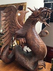 This large wood carved dragon is solid and heavy... and just in time to join you for a little Game of Thrones