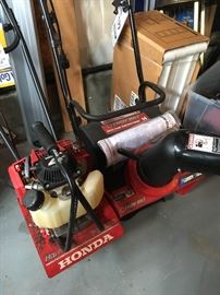 Sweet little roto tiller and another small snow blower, (new and unused)