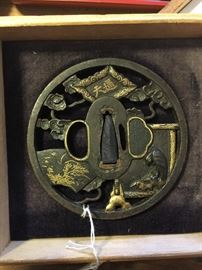 This Tsuba is authentic and a real work of art. It has some very intricate carving and color