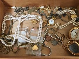 We still have the majority of costume jewelry to unpack, but we found this little box as well