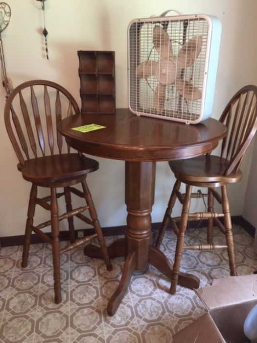 Oak pub table with 2 swivel chairs