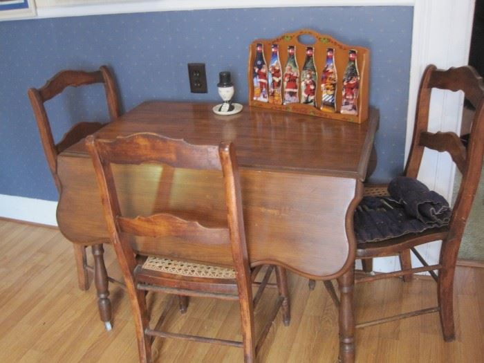 small drop leaf table & chairs & coca cola santa claus trays