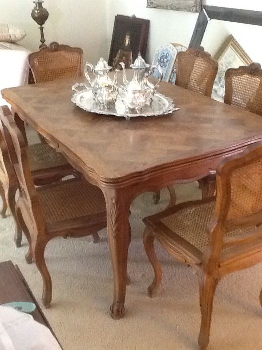 French dining table which will expand to seat 10 with six antique chairs.  
