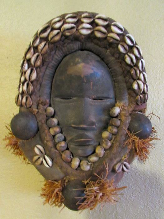 African lady's mask. Very intricate and was explained she was probably a person of honor. We have several African pieces in our collection.