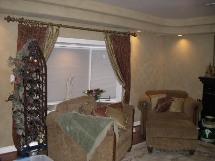 wine rack;  two sofa chairs;  curtains and curtain rod