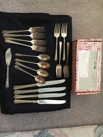 Four piece place setting of sterling silver