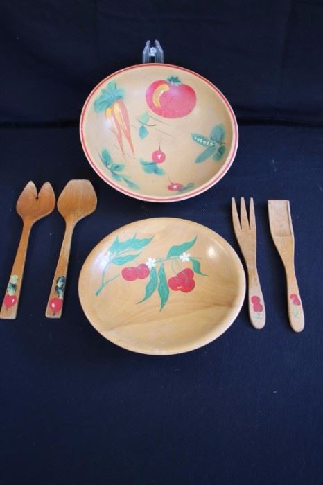 Hand Painted Woodware Salad Set: including two sets of salad servers (10" 11") and one 9" bowl for serving fruit hand painted with cherries and one 11" bowl for serving salad hand painted with carrots, peas radishes and tomato. The set is in very good condition with no chips in the hand painted decoration or visible wear to the wooden bowls.