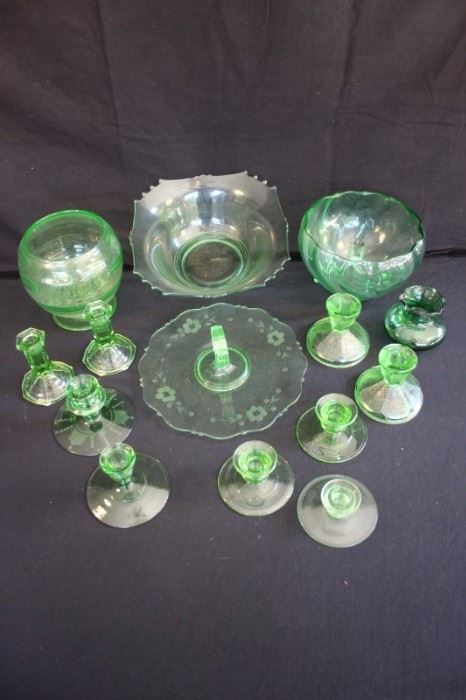 14 item Green Depression Glass Set: including three pairs of candlesticks 4-1/2", 4" and 3" and single candlesticks 1-1/2", 3" and 3-1/2"; 3 decorative and serving bowls 8",  6" and 10" and 10" finger sandwich serving platter with handle. (1929-1939)This lot is in very good vintage condition and shows little wear, if any.  - No chips, cracks, or deep scratching. As with all vintage items, some slight surface scratches can be seen on the tops of the plates from utensil use and some on the bottom from stacking and the glass is bright and clear. No staining or discoloration.