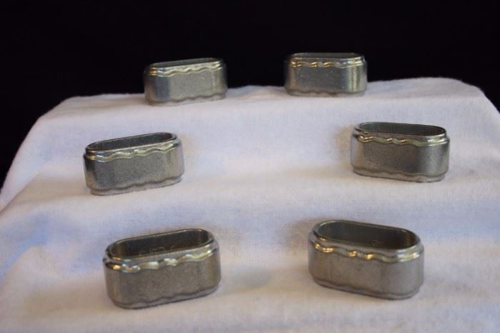 Six Armetale-like Napkin Rings by Pacific: 6 matching oval napkin rings marked Six matching 3.5' napkin rings marked with logos and PACIFIC Since 1929. In very good condition with no signs of wear and tear.