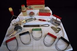 Set of 16 Miscellaneous Vintage Kitchen Utensils: Six with red handles: 1 Androck pastry blender Made in U.S.A. Pat. 1735236, 1 Androck pastry blender, aluminum biscuit cutter, stainless steel chopper, potato masher, melon baller; 1 Androck pastry blender green handle Pat. #173523, 2 Androck pastry blenders with black handles. Plastic and metal grater, Swans Down Cake Flour spatula, set of 5 aluminum measuring cups with copper-colored handles, set of 4 aluminum measuring spoons, stainless steel reamer marked Reemett Esnar Products Company, San Francisco, Calif., French Garnishing Cutter stainless steel in original box, Refrigerator-Mold "Icebox Cookie Maker" in original box with recipe pamphlet made by The Gladd Company, Minneapolis, Minnesota. All have wear of paint and some natural age rust, but seem to be in very good vintage condition for their age and really show the true vintage feeling and time period. (Check out the photos!)