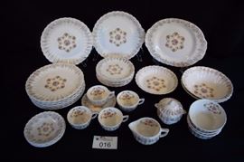 Large 35-Piece set of Ivory Franklinware: Warranted 22 K Gold Made in U.S.A..  1 12" oval meat plater, 11.5" round chop platter, 2 large  round serving bowls 9", 1 small round serving bowl  8", 8 10" dinner plates, 8 7.25" dessert plates, 4 coffee cups lightly stained, 5 saucers, 3 5" berry bowls, creamer and covered sugar. Because many of the items have been gently used, please anticipate some estate wear. All but one dessert plate have small chips under the rim mand one has a hairline crack on bottom rim; two cups are lightly stained. All other pieces are in very good condition with slight gold trim rubbing.