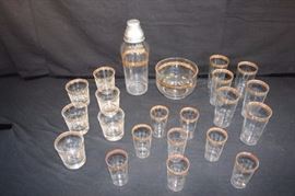 22 Piece Bar Set, Clear with Gold Trim: 6 high ball, 8 juice glasses 6 water goblets, small ice bucket (6") martini shaker (11") (1920-1930's).