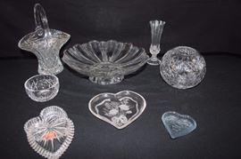 Cut and Pressed Glass Entertainment Set:  Pressed glass basket at 10" including handle; 2 heart shaped glass dishes (6", 3.5"); heart-shaped covered box by Gorham - Full Lead Crystal (4"); Crystal bud vase (7"); round candy dish (4"); globe-shaped vase (5.5" dia. x 5.5" H); footed, fluted glass platter (11.5" dia.). 