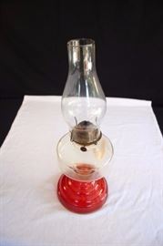 Eagle Oil Kerosene Hurricane Lamp: made in USA during the 1920-40's. Base is an orange-red, oil receptacle is clear as is the chimney. The lamp is 14" high. This lot is in very good condition and shows little wear, if any.
