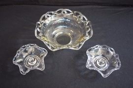 Depression Era Clear Serving Bowl with Candle Sticks: The ribbon pattern bowl is 4.5 high and 10" in diameter and the candlesticks are 2.5" high and 4.5" in diameter.  This lot is in very good condition and shows little wear, if any.