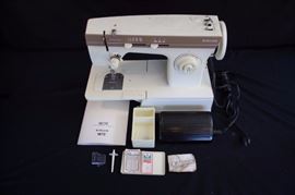 Merritt Singer Sewing Machine 1872 from 1987: Includes instruction manual printed in English, Spanish and French. It includes small accessory box with extra needles and bobbins, feed cover, the twin needle & spool pin. There is surface rust on the Needle thread tension dial, motor runs and servicing is suggested.