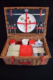 Vintage Brexton Picnic Basket/Hamper: This picnic set for 4 is immaculate as if it has never been used or removed from its case.The original THE BREXTON COLLECTION insert is included with instructions for replacement parts service and helpful hints for your picnic set. Contains 2 THERMOS Midi flasks with lids, Sandwich storage box "BREXTON" logo, 2 rectangular side dish containers, 2 round "Stewart MADE IN ENGLAND" food containers with lids, 2 storage jars , salt & pepper, corkscrew,4 mugs, 3 knives and spoons, 2 forks, 4 plates-one has original label “Melamina GIO’STYLE – inalterable-infrangible – lavable in lavastovglie – per almenti – made in Italy – serie WEEK-END – decore PAPAVERO” marked on the back “1 Melamina GOSTYLE  per almenti – made in Italy MW 101”. In excellent This lot is in very good condition and shows little wear, if any.