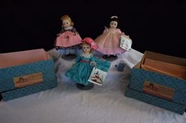 Vintage Madame Alexander Dolls: Three dolls featuring "Beth", "Miss Muffet" with tea cup and "Mary Mary" with watering can.  They are all stamped "ALEXANDER" with original tags. All 3 have 3-point articulation with sleepy eyes, painted face hair.  Their outfits are all complete including shoes .  "Miss Muffet" and "Beth" are in original boxes. This lot is in very good condition and shows little wear, if any. probably only used for display purposes. 