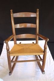 Child's Wooden Rocking Chair with Rush Seat: 22 inches tall, 13 1/2 inches wide. Both Wood and rush sheet are in very good condition and show very little wear.
