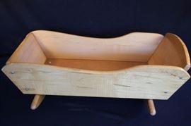 Vintage Wooden Cradle:  Sturdy with side to side rocking motion.  Measures 28.5"x 13.5" x 9.5" tall.  This lot is in very good condition and shows little wear, if any.