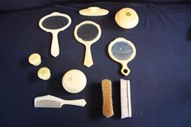 Vintage French Ivory Vanity Set:  (1920-30's) (also referred to as  pyralin or celluloid. 11 item consisting of: 3 hand mirrors, 2 small containers with screw on lids marked  Ivory Pyralin with monograms, 1 hair receiver, 1 covered powder container, 1 buffer marked Ivory Pyralin with monogram, 1 comb marked marked IVORY DU BARRY PYRALIN, 1 gentlemen's brush marked IVORY PYRALIN DU BARRY, 1 gentlemen's brush marked Ivory Pyralin. Used but in very good condition.