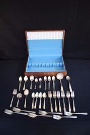 Miscellaneous Boxed Silverplated Flatware: 29-piece lot consisting of 4 grapefruit spoons WM Rogers Mfg. Co., 4 teaspoons marked E.P.N.5, 6 salad forks marked WM Rogers & Son, 6 salad forks marked Tudor Plate Oneida Community, 1 jelly server marked Community, 1 ornate small serving spoon with mother-of-pearl handle marked THBS, 1 ornate pickle fork marked 1847 Rogers Bros., 1 ornately slotted spoon marked Community Plate, 1 ladle marked Oneida Community Par Plate, 1 sugar spoon marked Sterling Ding Wall, 1 teaspoon marked WM. A Rogers Reinforced, 1 demitasse spoon marked FPNS, 1 demitasse spoon marked Birks.This lot is in very good condition and shows little wear, if any.
