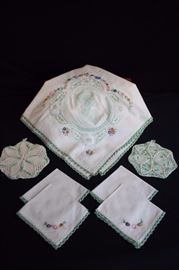 Mint Green Vintage Luncheon Set: Tablecloth 64" x 64", 4 napkins 10" x 11" all with hand crocheted edges and embroidered with Victorian girls & pastel flowers,2 hand crocheted potholders 6" in diameter. This lot is in very good condition and shows little wear, if any - no stains, rips or holes.