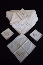 Pink Vintage Luncheon Set: Set: includes tablecloth 35" x 32", 4 napkins 10" x 10" all edged with pink and black cross stitch an decorated with pink & coral flowers, a large boudoir towel  32" x 18" with hand crocheted edging and hand embroidered flowers. This lot is in very good condition and shows little wear, if any - no rips, stains or holes.