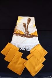 1970-80's Tablecloth & Napkins: Vintage 60" round tablecloth with fringe in tones of golds and browns and 6 gold napkins 14.5"x 14.5", in excellent condition and have never been used.