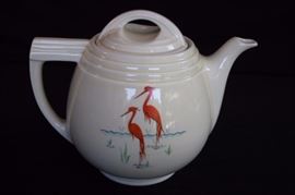 Hall's Superior Coffee Pot: Coffee Pot with lid by Hall was produced for the Enterprise Aluminum Company Circa 1960's.  Hall, well known for their teapots and other products, made their wares for many other companies.  This coffee pot is decorated with elegant flamingos on both sides and has all the beautiful lines of a Hall product.  It is a large pot that measures approximately 8" tall by 10" across mouth is 3.5"  The graphics are in excellent condition there is a 1.25" slight hairline crack at the brim of the pot.  It is marked on the bottom THE ENTERPRISE ALUMINUM CO. MASSILLON, OHIO, SUPERIOR QUALITY KITCEHN WARE Drip-O-later TRADE MARK REG. U.S. PAT. OFF. PTENT NOS.1370782-1743925. The graphics are in excellent condition and the water pitcher is in very good condition, no chips or cracks.