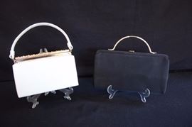 Two 1940-60's Evening Bags: After Five Made in USA cream evening purse with gold clasp and attached coin purse inside measures 8" at bottom, from clasp to bottom 5" with a 14" handle; very nice and clean on the outside and satin lining is in perfect condition. After Five Made in USA, Black Satin Purse with attached coin purse inside measures 10"at bottom, from clasp to bottom 6" with an 8" handle; very nice and clean condition with beautiful satin lining.