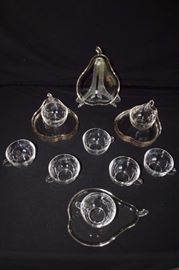 Pear Glass Luncheon Plates with Cups:  8 pear shaped stemmed glass plates with lip, measures 9" x 7". 8 glass tea cups with handles. Measures 4" diameter, 2.5 tall. No chips or cracks. 1950-60's. This lot is in very good condition and shows little wear, if any - no chips or cracks