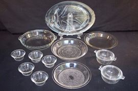 12 Piece Pyrex & Glass bake Lot:  2 small 10 ounce covered cassoulets (1 lid has a chip) 4.5" diameter 2" tall marked Pyrex Made in USA 018 and 36; 5 small custard dishes marked Glass bake 286; 1 7 3/8" Glass bake Clear Glass Pie Plate - 1941-1949 and 1 8.5" Glass bake Clear Glass Pie Plate - 1941-1949; 1 Pyrex  clear glass 9" pie plate dish marked 209 Pyrex U.S. Pat. Off. S-M and 1 Pyrex clear glass 10" pie plate with crimped edge and handles marked Pyrex 229 for Oven and Microwave no Stovetop or Broiler Corning NY USA G-13; well and tree oval meat platter 15" x 10" marked Pyrex for Oven and Broiler Use Only 815 A-.?? This lot is in very good condition and shows little wear, if any - no chips or cracks.