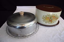 Two Vintage Cake Carriers:  One tin carrier for a 9.5" cake, 10.5" lid, 11.5 cake pan, stands 6" high, marked Balloneff Cleveland Ohio Made in U.S.A Cake Carrier decorated in Fall colors (nice graphics) (1970's); metal and glass carrier for a 9.5" cake, 10" metal lid, 11.5 pressed glass cake pan, stands 4.5" high (1940-50's). This lot is in very good condition and shows little wear, no chips or cracks on glass piece.